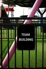 Sign Displaying Team Building Concept in Outdoor Recreational Area