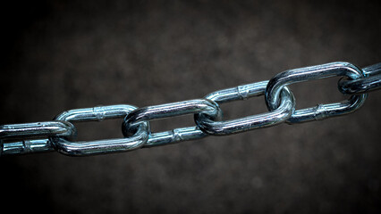 Fototapeta premium wide banner of a metal linked chain with foreground focus and space for copy