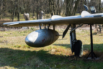 Old Polish military aircraft on display in an outdoor setting near historic region