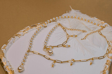 Beautiful handmade necklace and braclet on background