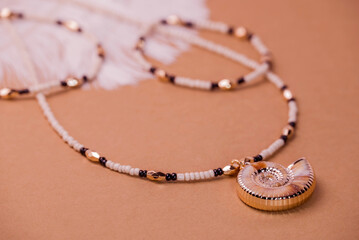 Beautiful handmade necklace and braclet on background
