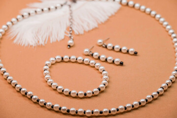 Beautiful handmade necklace and braclet on background
