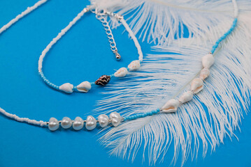 Beautiful handmade necklace and braclet on background
