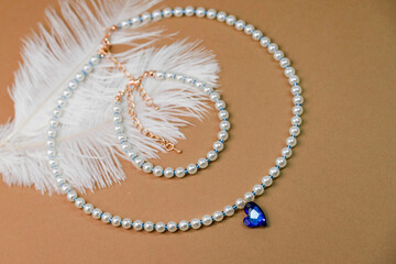Beautiful handmade necklace and braclet on background