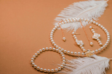 Beautiful handmade necklace and braclet on background