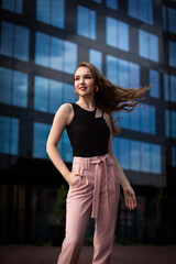 Portrait of beautiful young model in city center