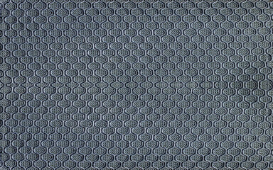 gray  textured surface with a geometric honeycomb pattern offers a detailed background view, ideal...