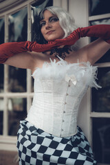 Expressiveness in black and white fashion with vibrant red accents at an elegant urban venue during...