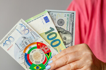 BRICS currency design and 100 euro and 100 dollar banknotes. Concept, currency systems, financial transactions, and the creation of a common currency by BRICS countries.