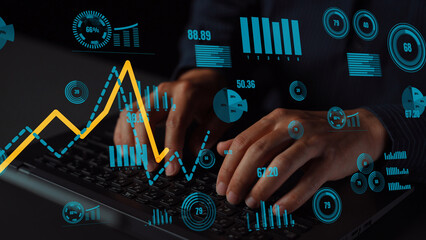 A focused scene of hands typing on a keyboard surrounded by vibrant analytics graphics,...