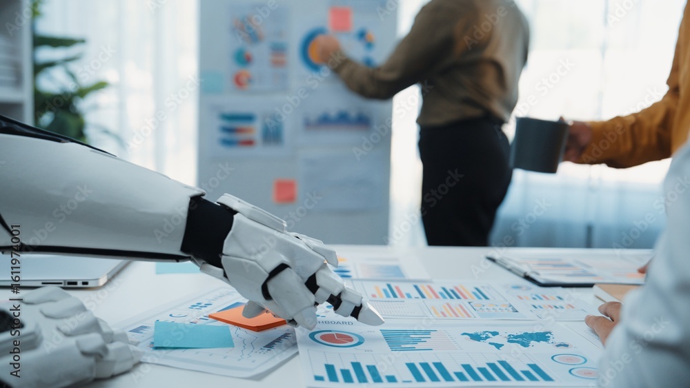 Poster a robotic hand interacts with business reports in a modern office, showcasing collaboration and inno