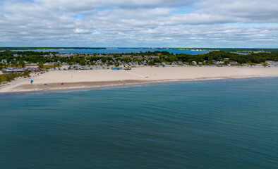 Aerial Drone View of Muskegon and Norton Shores Michigan Over Lake Michigan Coastline 2025