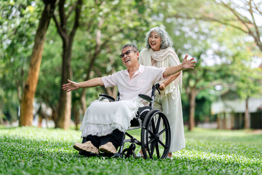 Active senior couple enjoys happy outdoor park experience showing genuine love companionship and vibrant healthy living - Powered by Adobe