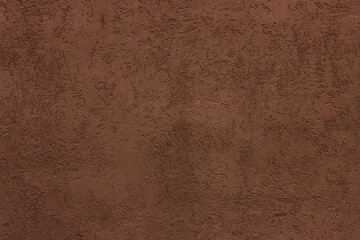 Abstract background of dark brown plaster.