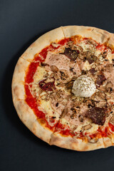 Fresh Homemade Italian Pizza with mozzarella, tomato, ham, mushrooms, peperoni, basil