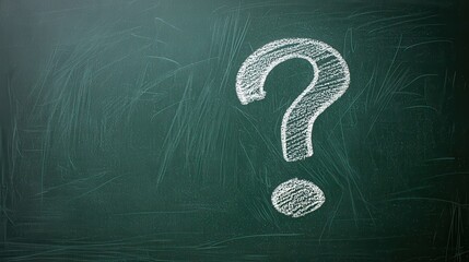 White Chalk Question Mark on Dark Green Chalkboard Surface