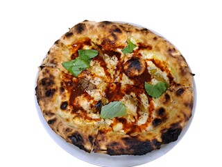 Close-up of Neapolitan pizza with mozzarella, tomato and basil on a white background