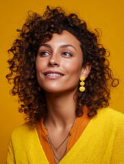 Happy Woman With Curly Hair, Vibrant Yellow Background, High Contrast But Soft Light, Colorful Fashion, Studio Portrait