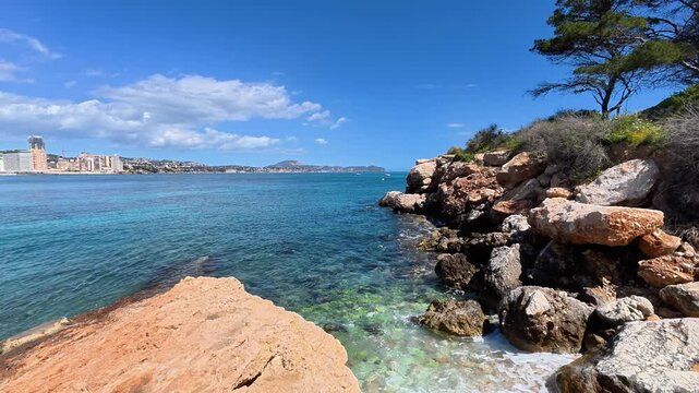 A stunning and beautiful coastal scene that showcases crystalclear waters and impressive rocky formations