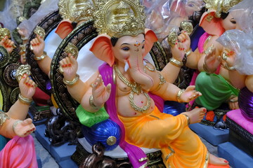 Newly made idols of the God known as Ganesha or Ganapati for sale at a shop on the eve of Ganesh festival in Pune, India.