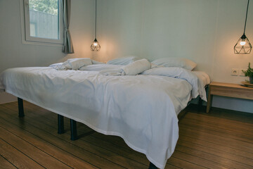 Modern minimalist bedroom with geometric pendant lights