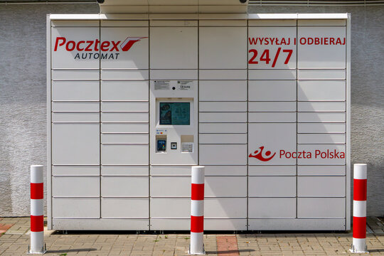 Pocztex parcel locker by Poczta Polska with 24/7 access, outdoor view on sidewalk