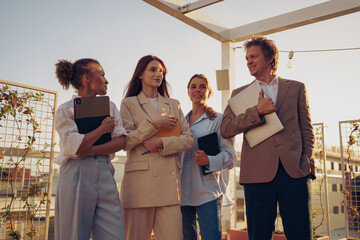 A group of diverse professionals is actively engaging in a fruitful business discussion outdoors,