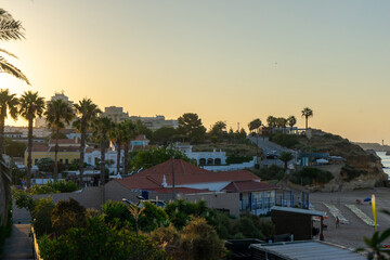 Morning view of Praia do Vau in Portimão, Algarve – calm sea, golden sand, and soft light over cliffs. Peaceful coastal scene ideal for travel and nature concepts.