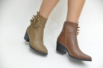 Model of women's boots on a white background