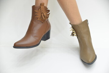 Model of women's boots on a white background