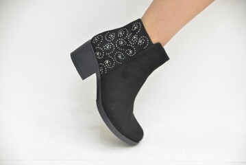 Model of women's boots on a white background