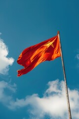 Celebrating vietnam national day with patriotic red flag against blue sky. Independence Day of Vietnam. Vertical banner. Copy space. Flag of Vietnam