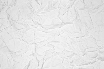White crumpled paper texture background. Abstract wrinkled and creased paper surface. Grunge overlay or wallpaper pattern for design.