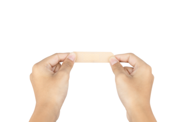 Two hands opening an adhesive bandage, preparing for first aid application. Healthcare and medical care concept. isolated on white background with clipping path.