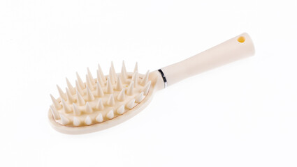 white plastic massage hair comb isolated on white background