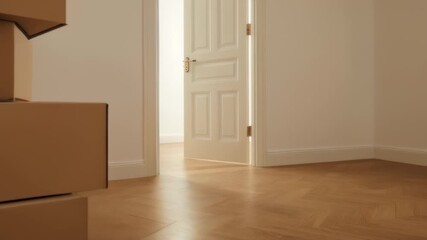 soundproof door Sustainable packaging materials strip Dropshipping extra space mudango Airmee bed-in-a-box Wooden Street Cardboard moving boxes stacked by open white in empty room. Peaceful relocatio