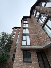 Modern Brick Apartment Building with Large Windows