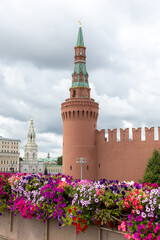 Bright flowers adorn bridge near Kremlin in Moscow's Red Square on cloudy day