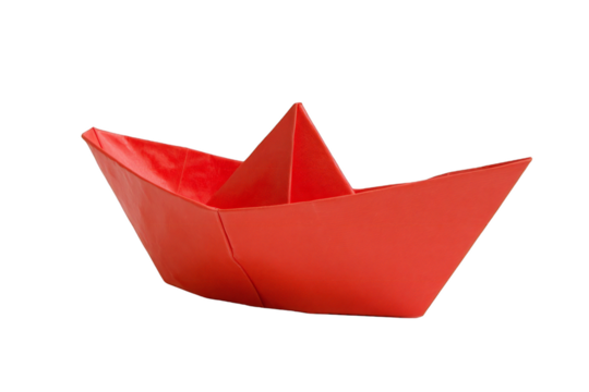 Photo of a simple red origami paper boat isolated on a transparent background