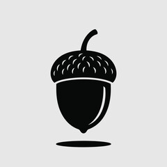 Simple black silhouette of an acorn on a light gray background