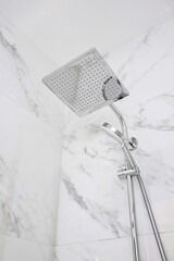 Chrome chower head close-up in the shower room