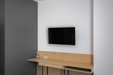 Flat TV hangs on the wall