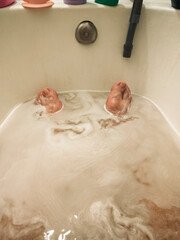 Man in a bath. Male client in an aroma bath at a spa