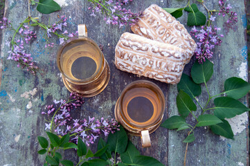 tea and cookies with lilsc flowers