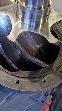 Shiny new screw compressor rotors rotating smoothly