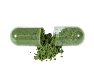 Vibrant green superfood powder spills from a clear open capsule, promoting natural wellness and healthy living.