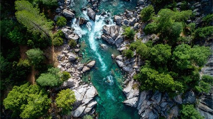 Scenic river cascading through a rocky, forested landscape. Aerial view of nature's raw power and serene beauty.