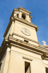 Clock Tower in Pamplona, Spain Against a Blue Sky