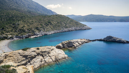 Turquoise Bay with Rocky Peninsula and Hills