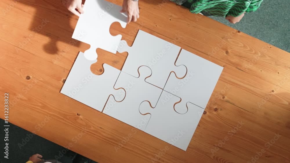 Aufkleber top view of business man gathering last piece of jigsaw to complete puzzle. group of diverse team wo